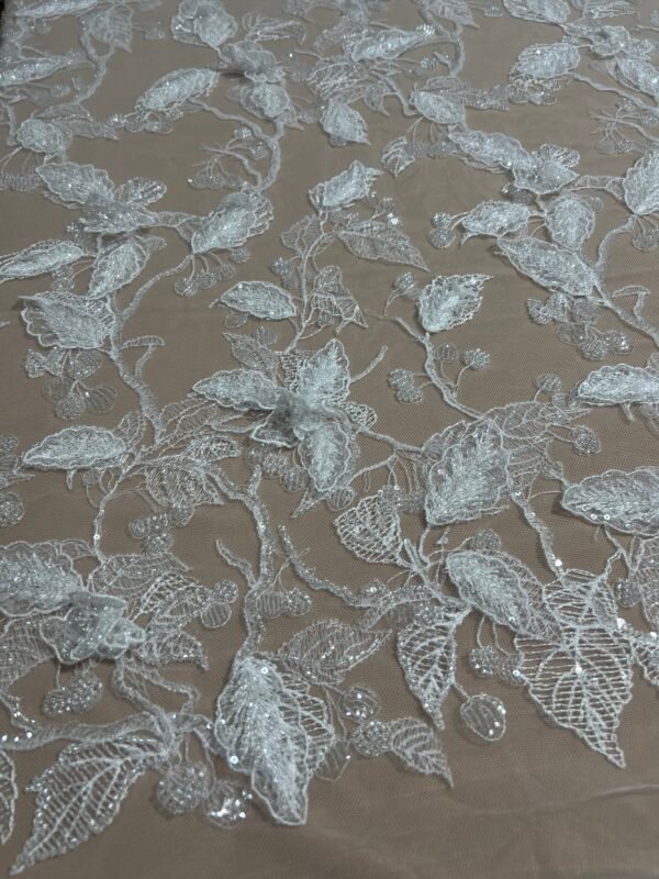White lace with 3D leaf appliqués, beads, and stitching
