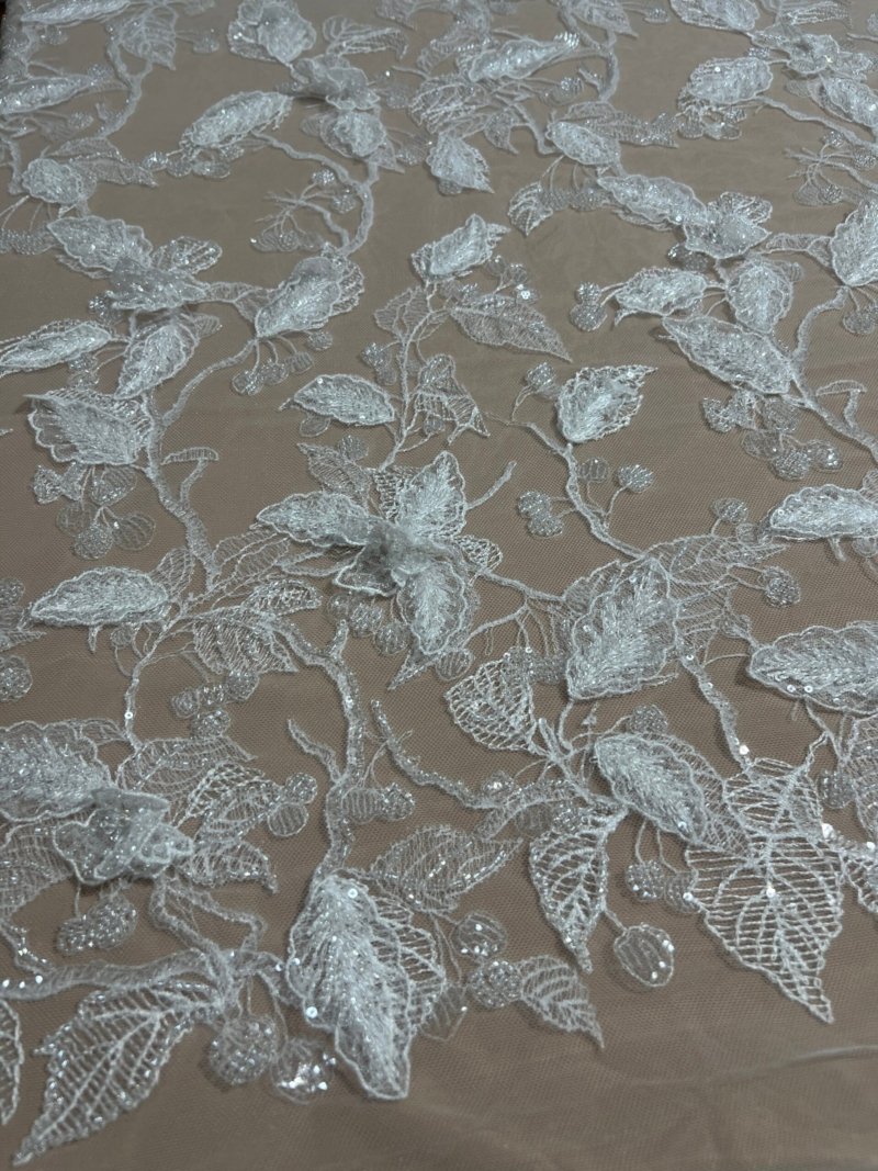 White lace with 3D leaf appliqués, beads, and stitching